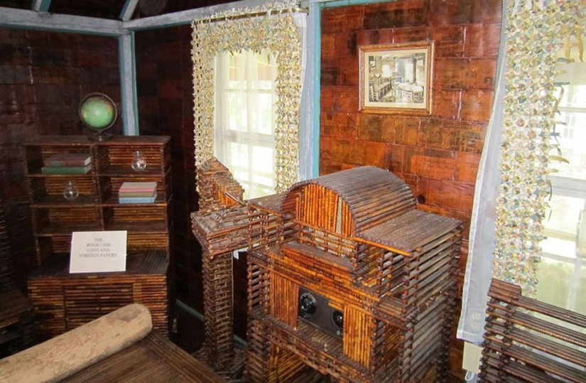 A house where everything is from newspapers: walls, furniture, and even curtains