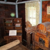 A house where everything is from newspapers: walls, furniture, and even curtains