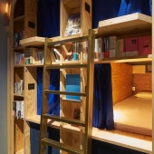 A new themed hostel in Kyoto offers to spend the night on a bookshelf