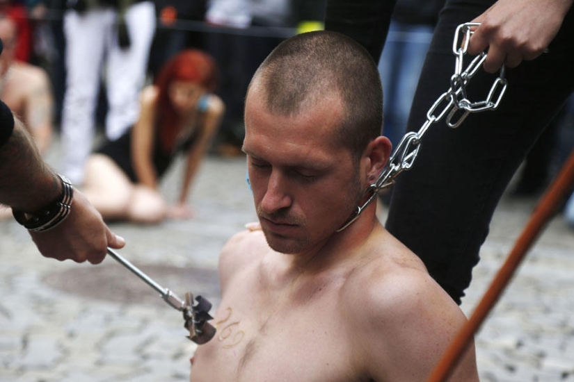 Animal rights activists brand themselves with a red-hot iron