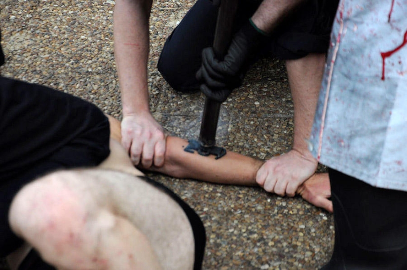 Animal rights activists brand themselves with a red-hot iron