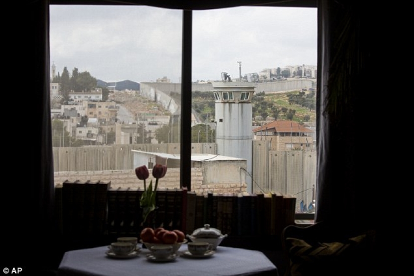 Banksy opened a hotel with the "worst view in the world" — the wall between Israel and Palestine Banksy opened a hotel with the "worst view in the world" — the wall between Israel and Palestine