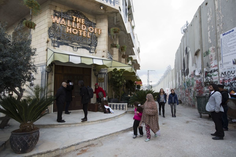 Banksy opened a hotel with the "worst view in the world" — the wall between Israel and Palestine Banksy opened a hotel with the "worst view in the world" — the wall between Israel and Palestine