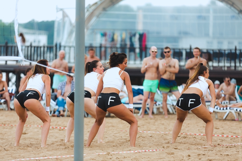 Beach volleyball tournament among models