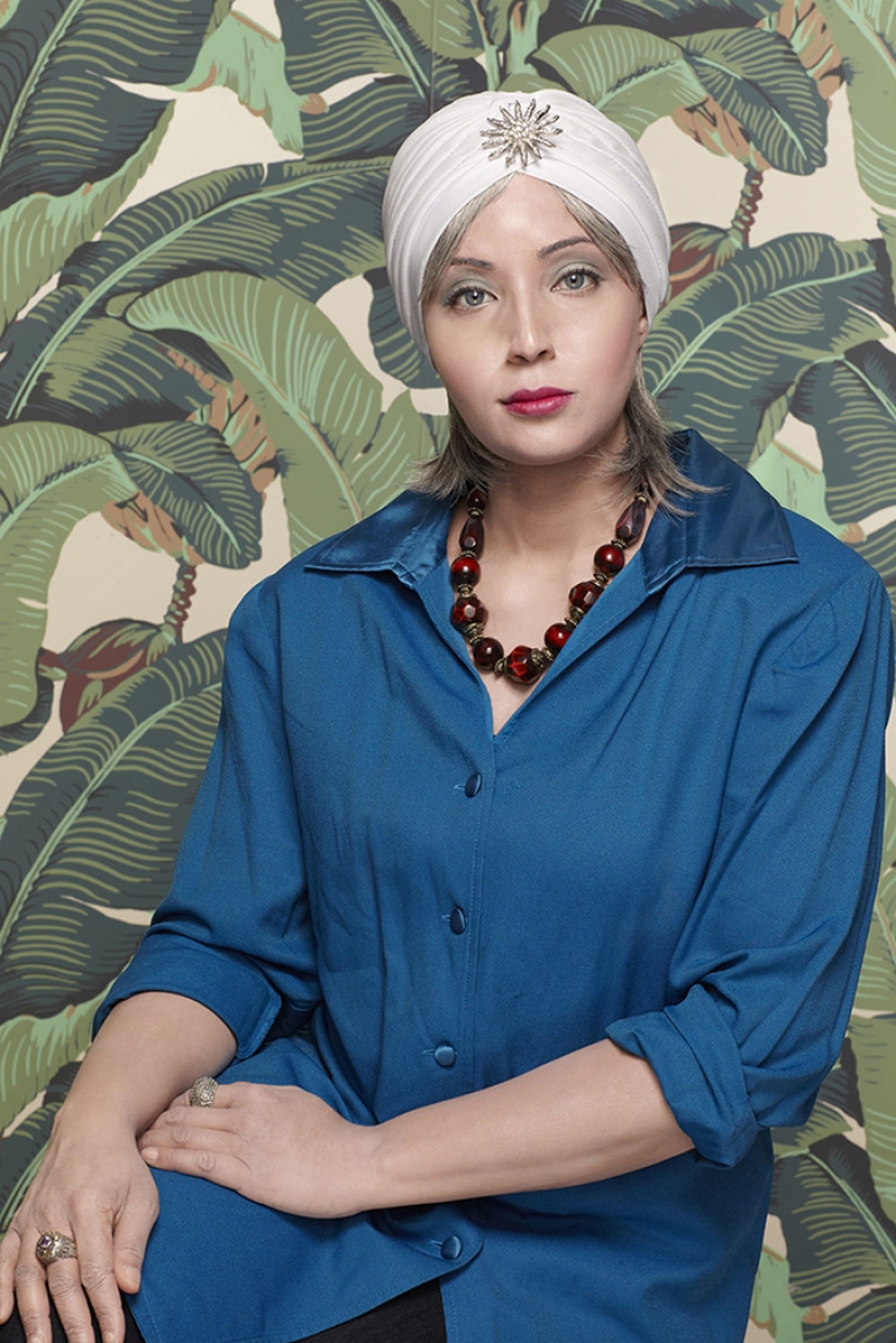 Black and white photo: a mulatto woman takes pictures of herself in the image of her white ancestors