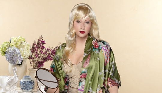 Black and white photo: a mulatto woman takes pictures of herself in the image of her white ancestors