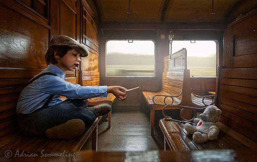 Childhood in the frame: dad takes a picture of his son Childhood in the frame: dad takes a picture of his son