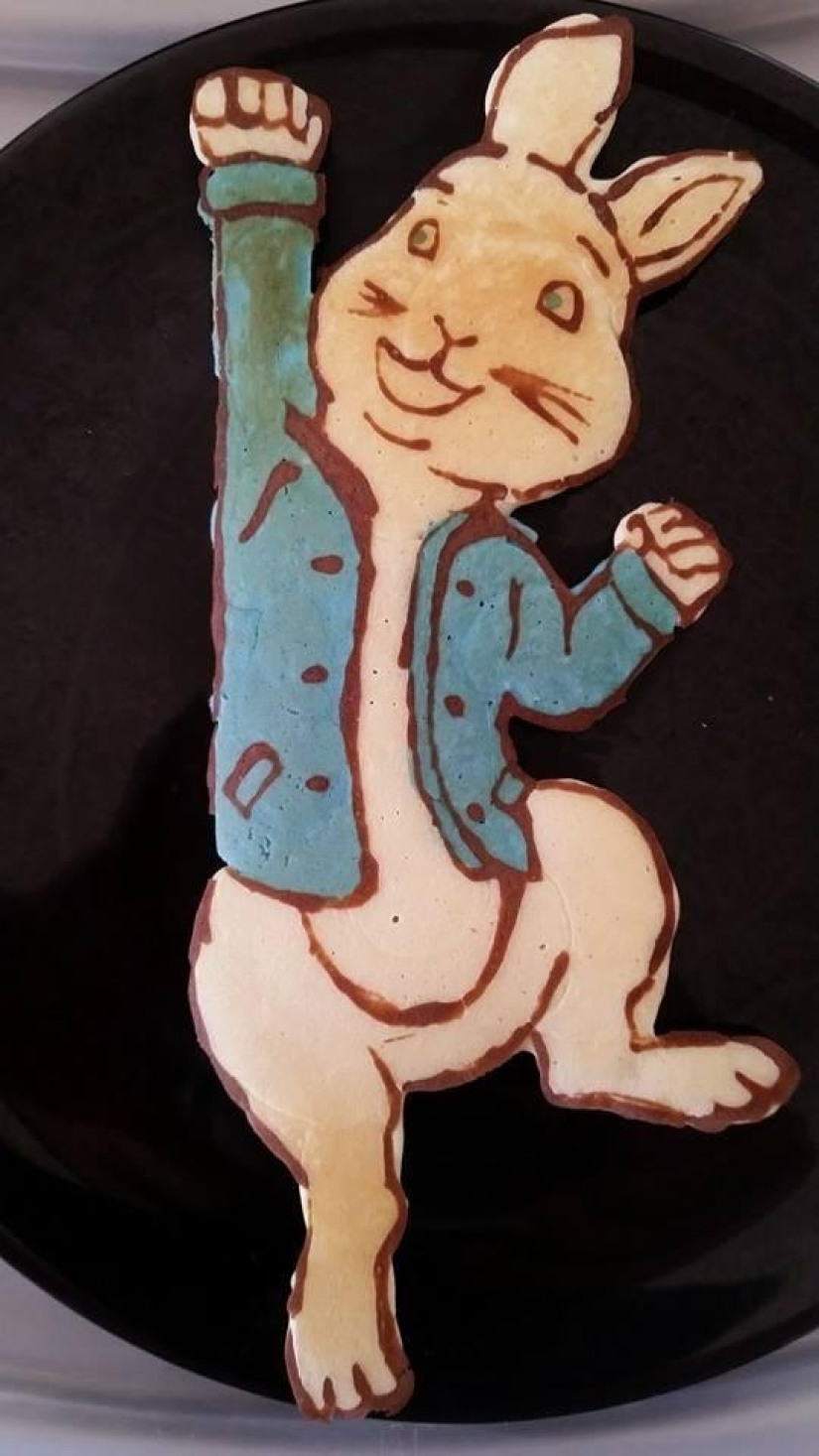 Creative dad bakes fantastic colorful pancakes for his child