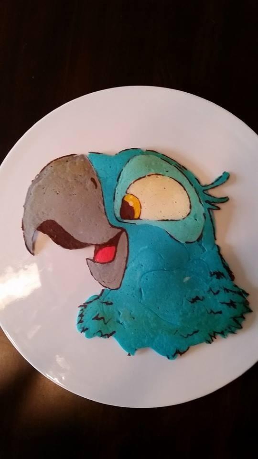 Creative dad bakes fantastic colorful pancakes for his child