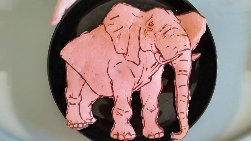 Creative dad bakes fantastic colorful pancakes for his child