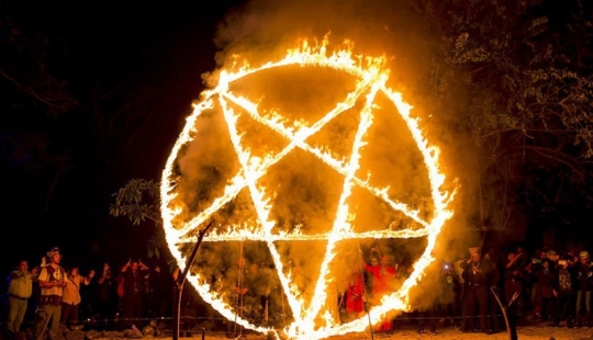 Forbidden photos from the chilling black mass of Satanists