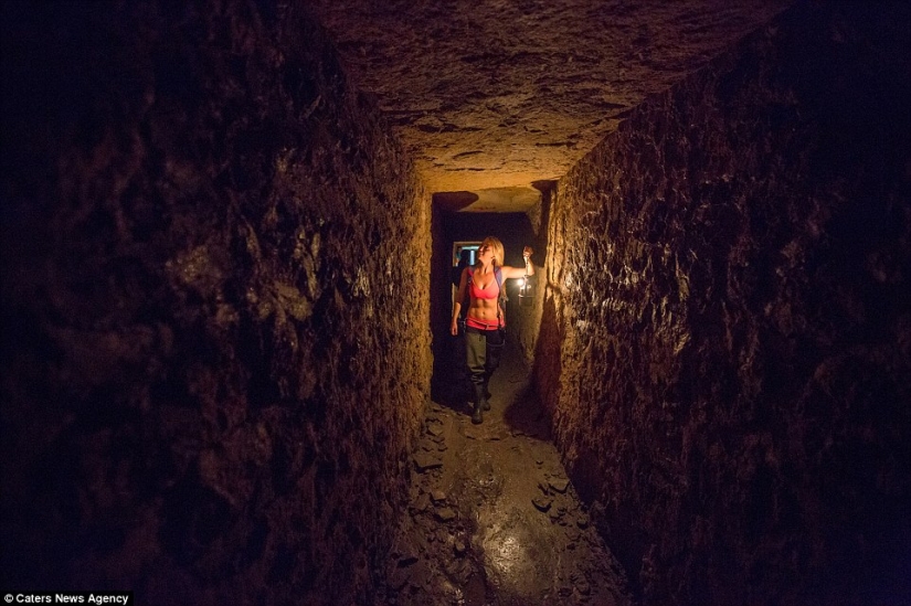 Indiana Jane: An American woman on a surfboard explores the skeletal catacombs of Paris Indiana Jane: An American woman on a surfboard explores the skeletal catacombs of Paris