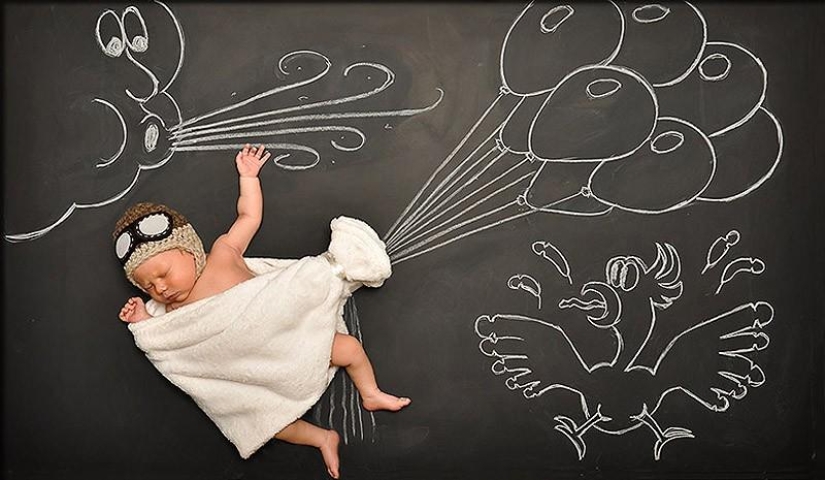 Mamá toma una foto del bebé en el "Tablero de aventuras" Mamá toma una foto del bebé en el "Tablero de aventuras"