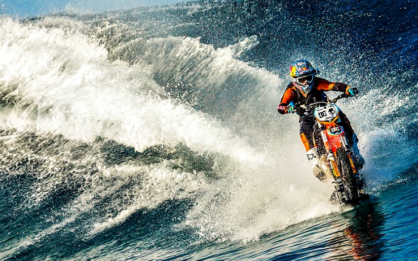 Surfing legend: Robbie Maddison rides a wave on a motorcycle