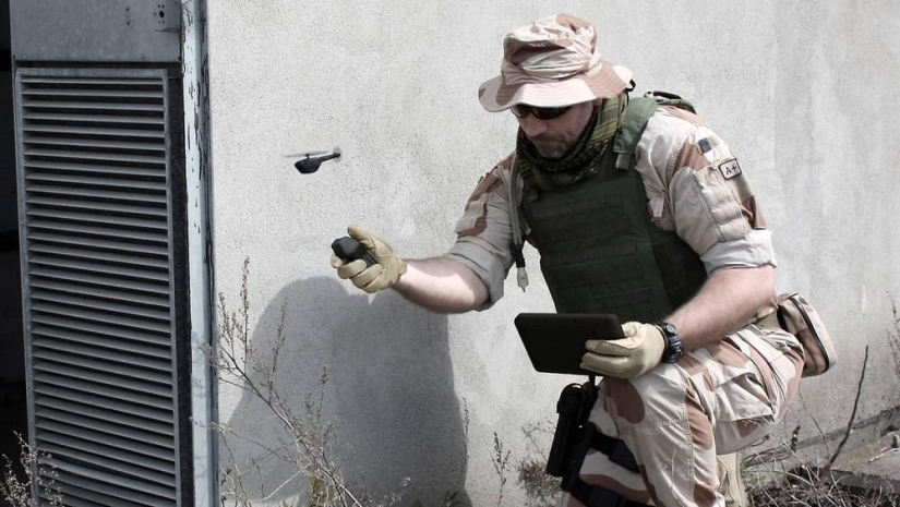 The Black Hornet is a military helicopter drone that fits in the hand The Black Hornet is a military helicopter drone that fits in the hand