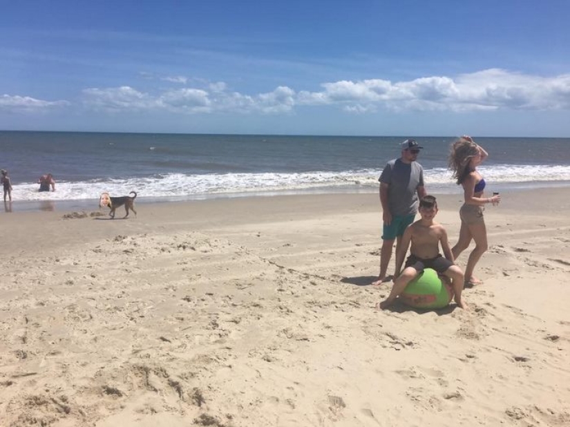 The girl couldn't go to the beach with her friends, so she put herself in their photo