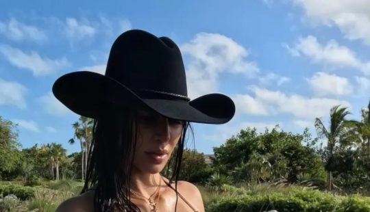 Kim Kardashian heats up spring break in a tiny bikini and body chains: ‘Cake Boss’