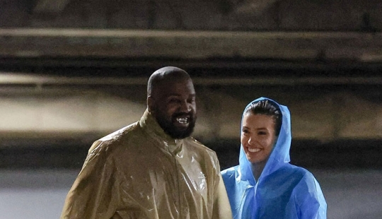 “Unbelievable, She’s Smiling”: Bianca Censori Dons Raincoat But Little Else With Husband Kanye