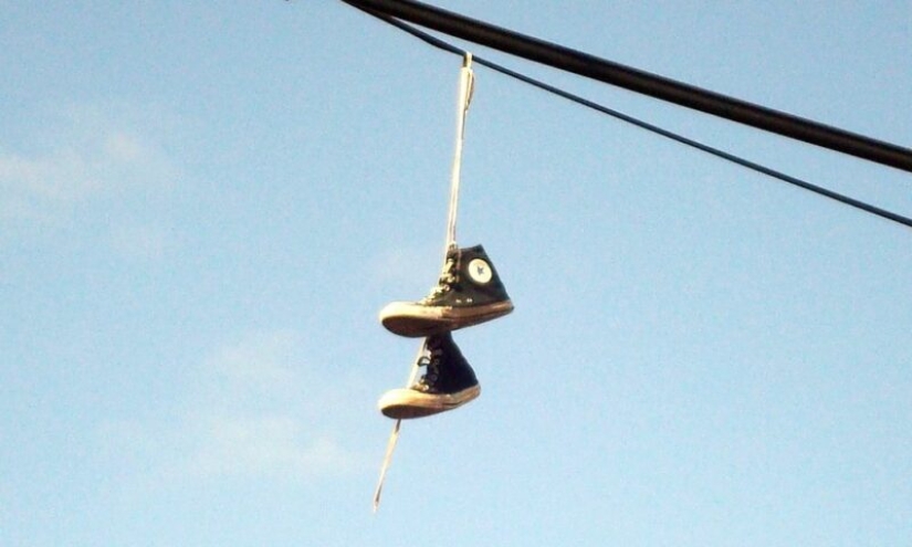 6 theories explaining the strange custom of hanging shoes on wires