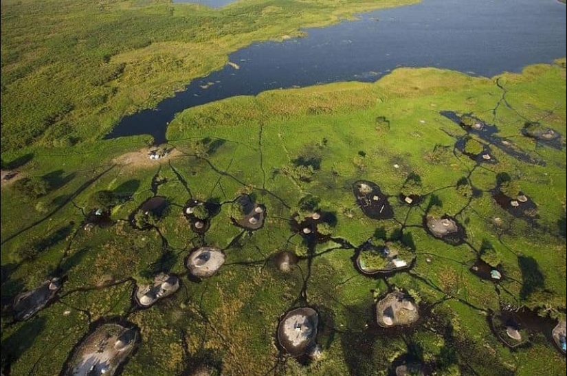 A picturesque village in a swamp in South Sudan A picturesque village in a swamp in South Sudan