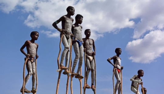 Always on top: why Banna men prefer to walk on stilts