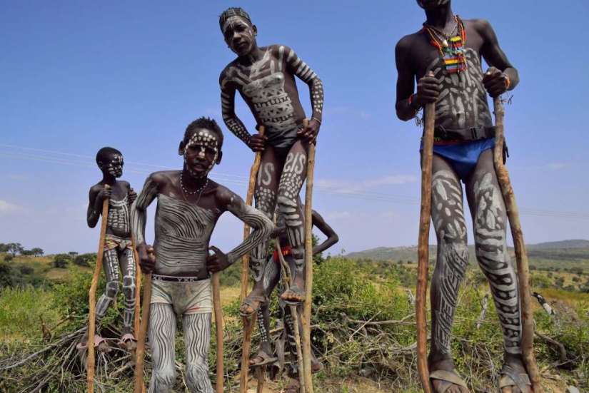 Always on top: why Banna men prefer to walk on stilts