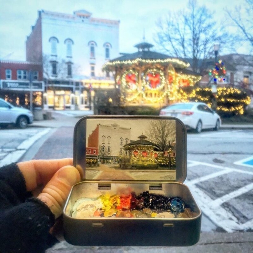Artista dibuja las miniaturas de los paisajes en las cajas del caramelo