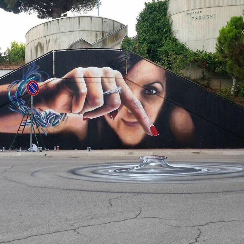 Callejero interactivo de arte: el artista entra en 3D pinturas en la calle Callejero interactivo de arte: el artista entra en 3D pinturas en la calle