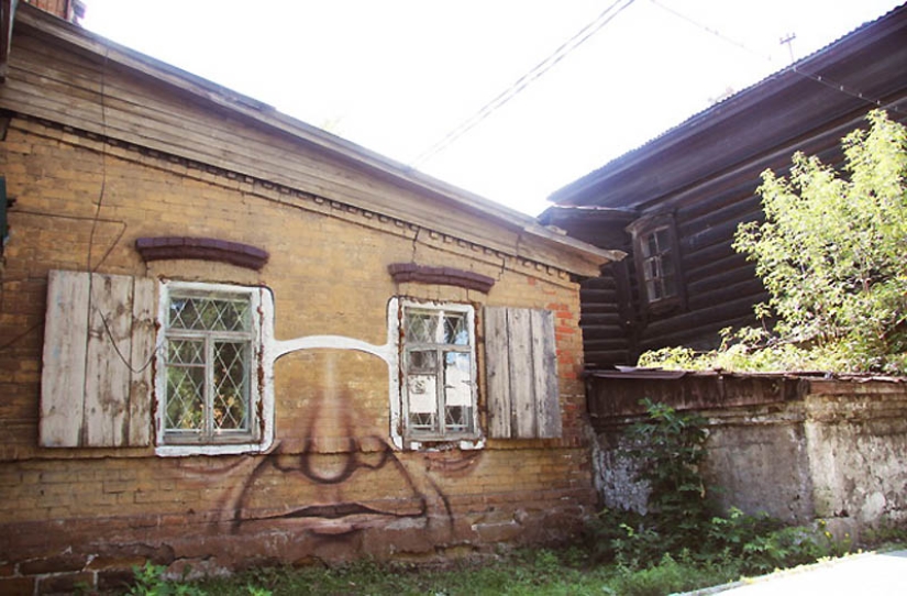 Faces on buildings by Nikita Nomerz
