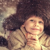 How did the hat-earflaps appear and why is it not a native Russian headdress