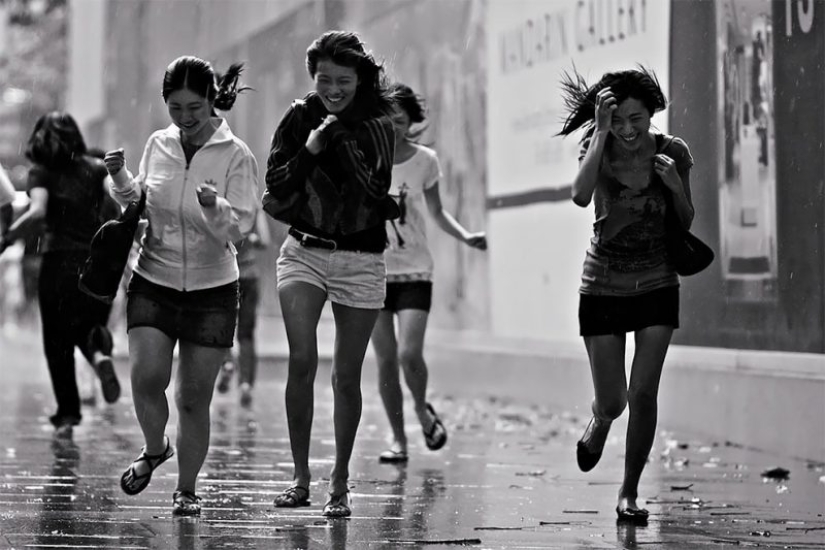 Rainy mood: a photographer from Singapore catches the emotions of people during a downpour