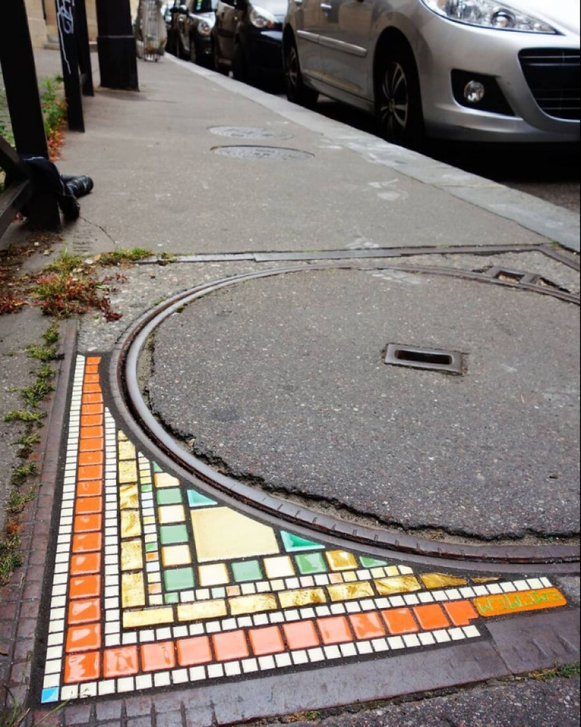 Road surgeon from Lyon: Street artist patches potholes with mosaics Road surgeon from Lyon: Street artist patches potholes with mosaics