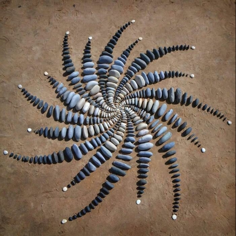 The artist creates the mood of their stunning works from the stones on the beach The artist creates the mood of their stunning works from the stones on the beach