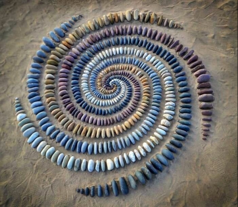 The artist creates the mood of their stunning works from the stones on the beach The artist creates the mood of their stunning works from the stones on the beach