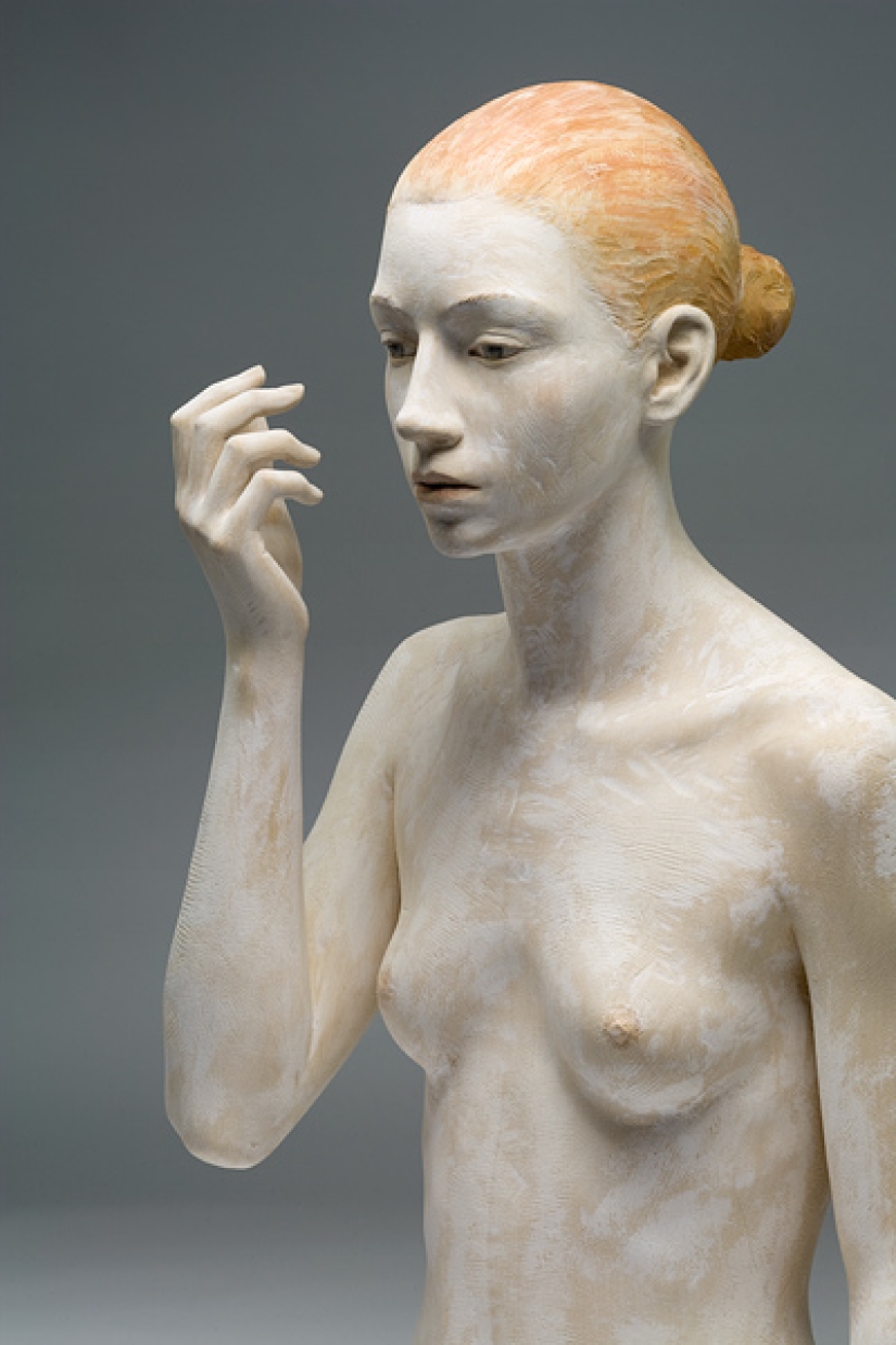 Youth captured in hyper-realistic wood sculptures