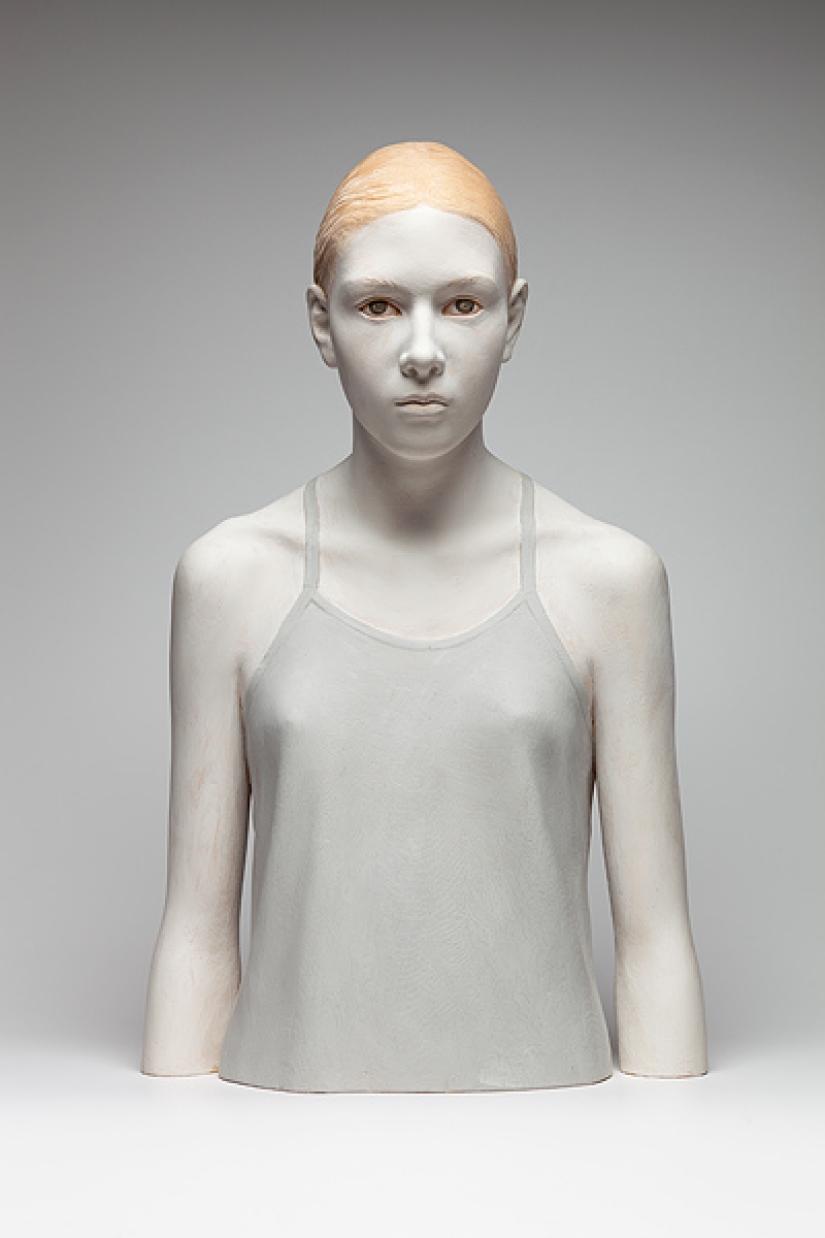 Youth captured in hyper-realistic wood sculptures