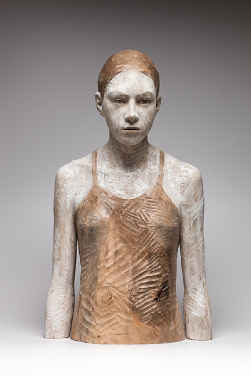 Youth captured in hyper-realistic wood sculptures