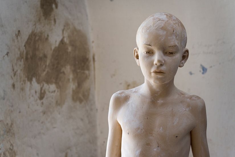 Youth captured in hyper-realistic wood sculptures