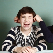 How did the custom of pulling boys' ears on their birthday come about